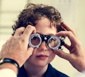 little-boy-getting-his-eyes-checked
